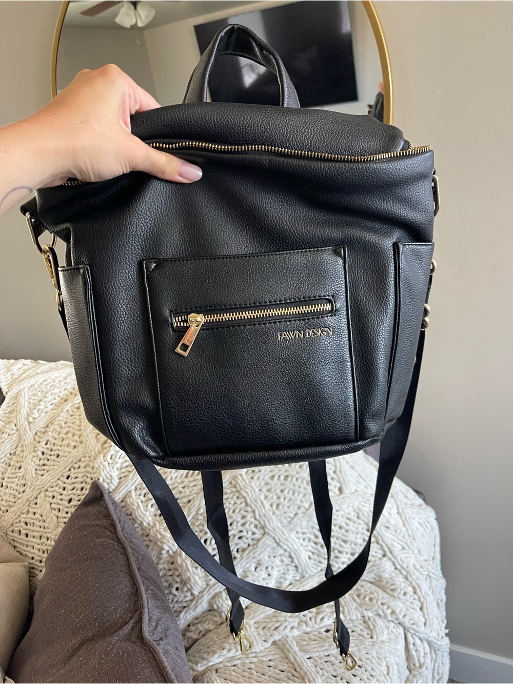 Mini fawn Design Black bag. Straps for a crossover or can be used as a backpack
